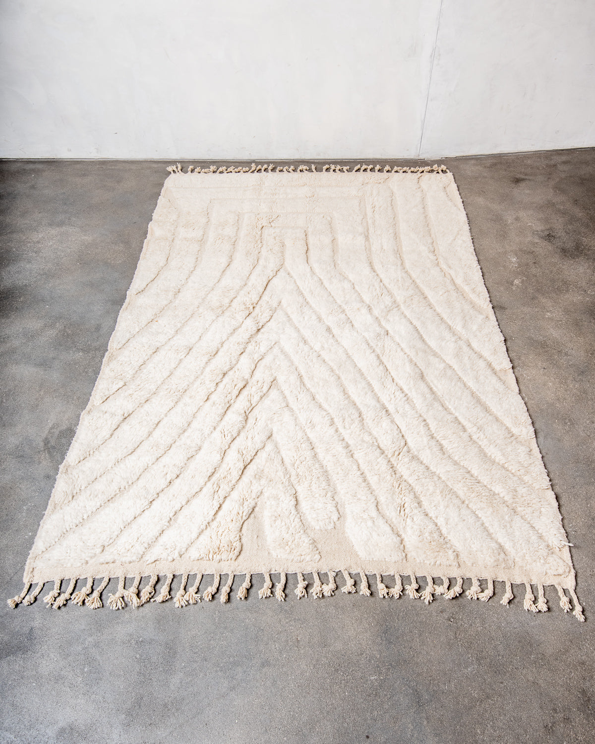 Modern, designer, handcrafted Berber rug from Morocco. Beniourain carpet with minimalist design, natural wool pile and a fluffy texture.